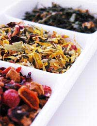 a tray with 3 different types of herbal tea displayed